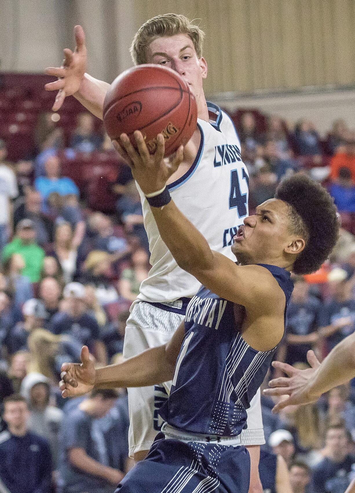 King's Way's Khalfani Cason (1) shot is blocked by Lynden Christian's George DeJong (41) in the WIAA 1A boys state basketball tournament on Thursday, Mar. 1, 2018, at the Yakima Valley SunDome. The Lynden Christian Lyncs defeated King's Way Christian Knights 87-63.