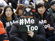 Female workers supporting the MeToo movement wearing black attend a rally to mark the International Women's Day in Seoul, South Korea, Thursday, March 8, 2018.