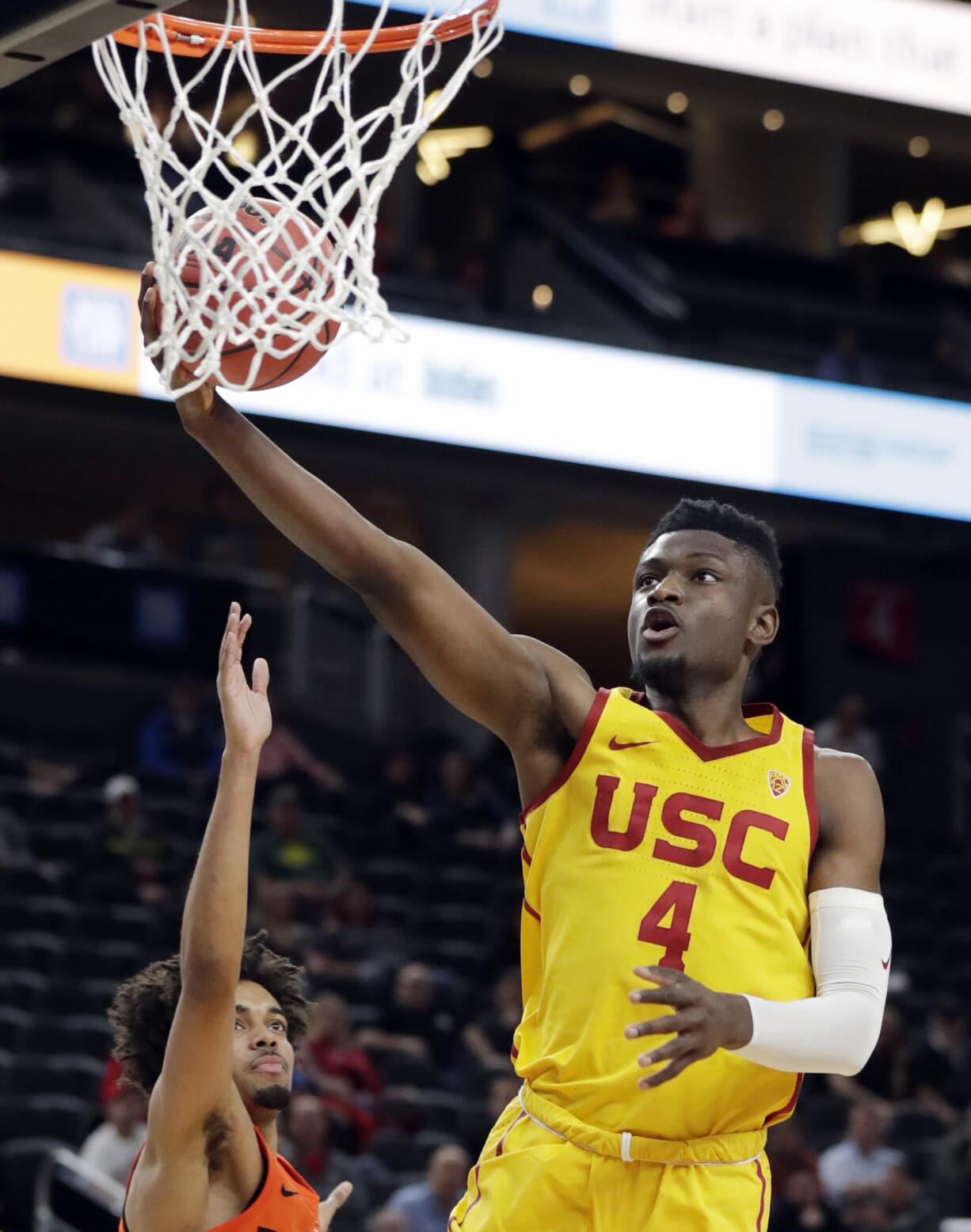 Southern California's Chimezie Metu (4) shoots during the first half of the team's NCAA college basketball game against Oregon State in the quarterfinals of the Pac-12 men's tournament Thursday, March 8, 2018, in Las Vegas.