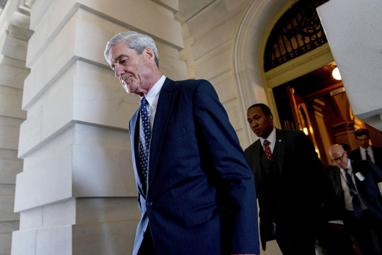 FILE - In this June 21, 2017, file photo, former FBI Director Robert Mueller, the special counsel probing Russian interference in the 2016 election, departs Capitol Hill following a closed door meeting in Washington. President Donald Trump is questioning the impartiality of Mueller's investigation and says the probe is groundless, while raising doubts about whether a fired top FBI official kept personal memos outlining his interactions with Trump.