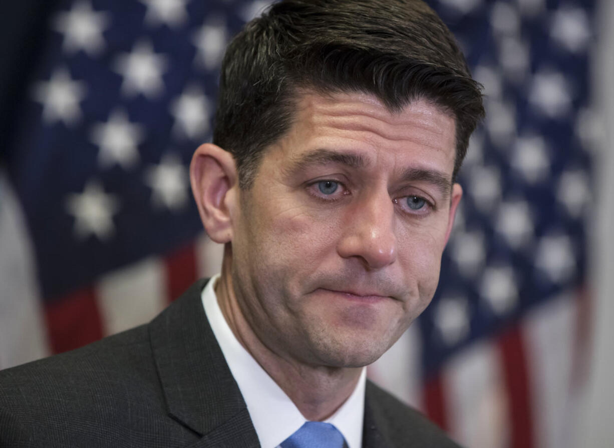 Speaker of the House Paul Ryan, R-Wis., meets with reporters following a closed-door Republican strategy session on Capitol Hill in Washington, Tuesday, March 20, 2018. Ryan says he's hoping bargainers can resolve the final disputes in a government-wide spending bill in time for Congress to begin voting Thursday on the measure.  (AP Photo/J.