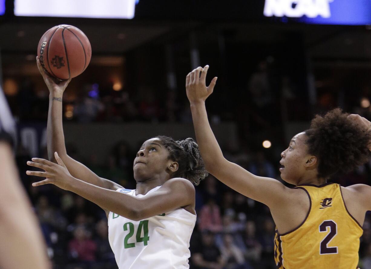 Oregon forward Ruthy Hebard (24) shoots in front of Central Michigan forward Tinara Moore (2) during the first half in a regional semifinal at the NCAA women's college basketball tournament, Saturday, March 24, 2018, Spokane, Wash.