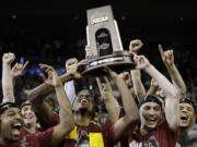 Loyola-Chicago players celebrate a regional final NCAA college basketball tournament game against Kansas State, Saturday, March 24, 2018, in Atlanta. Loyola-Chicago won 78-62.