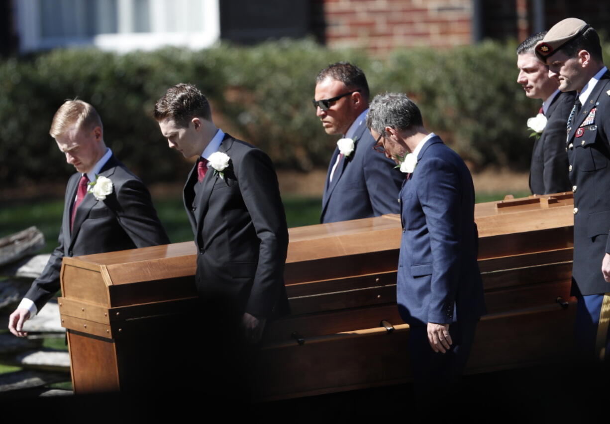 The casket of The Rev. Billy Graham is moved during a funeral service at the Billy Graham Library for the Rev. Billy Graham, who died last week at age 99, on Friday in Charlotte, N.C.