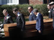 The casket of The Rev. Billy Graham is moved during a funeral service at the Billy Graham Library for the Rev. Billy Graham, who died last week at age 99, on Friday in Charlotte, N.C.