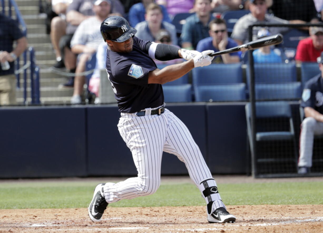 New York Yankees pinch hitter Russell Wilson, a Seattle Seahawks quarterback, strikes out in the fifth inning of a baseball spring exhibition game against the Atlanta Braves, Friday, March 2, 2018, in Tampa, Fla.