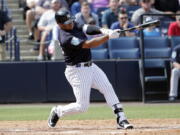 New York Yankees pinch hitter Russell Wilson, a Seattle Seahawks quarterback, strikes out in the fifth inning of a baseball spring exhibition game against the Atlanta Braves, Friday, March 2, 2018, in Tampa, Fla.