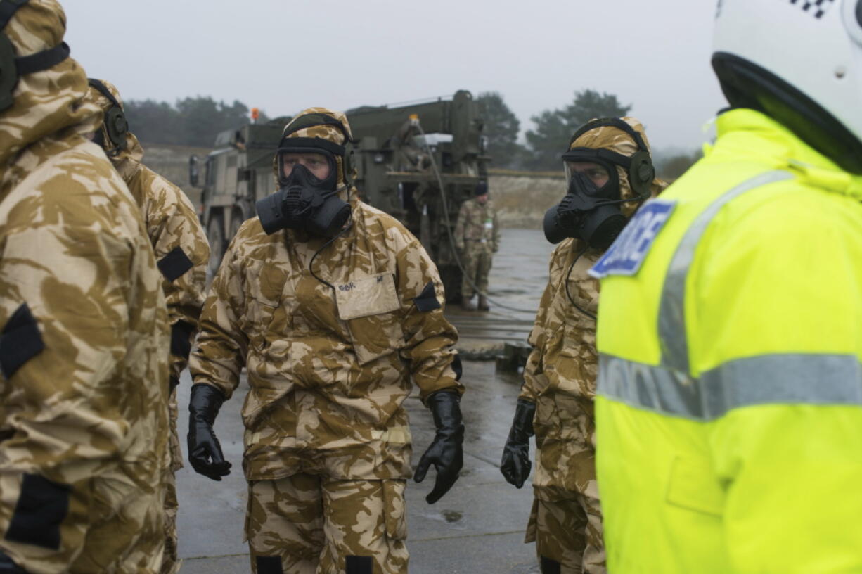 Members of the Falcon Squadron, Royal Tank Regiment, conduct final preparations and training Friday in Winterbourne Gunner, England, before deploying to help civil authorities in Salisbury.