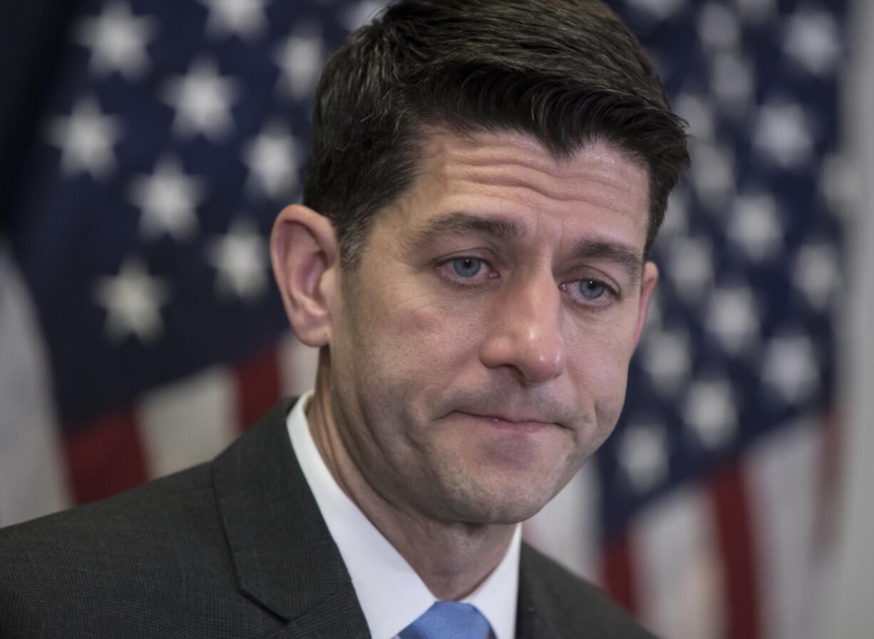 Speaker of the House Paul Ryan, R-Wis., meets with reporters following a closed-door Republican strategy session on Capitol Hill in Washington, Tuesday, March 20, 2018. Ryan says he’s hoping bargainers can resolve the final disputes in a government-wide spending bill in time for Congress to begin voting Thursday on the measure. (AP Photo/J.
