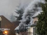 Camas-Washougal Fire Department responders and personnel from other departments were able to quickly extinguish this garage fire Tuesday morning in Camas. A vehicle was damaged.