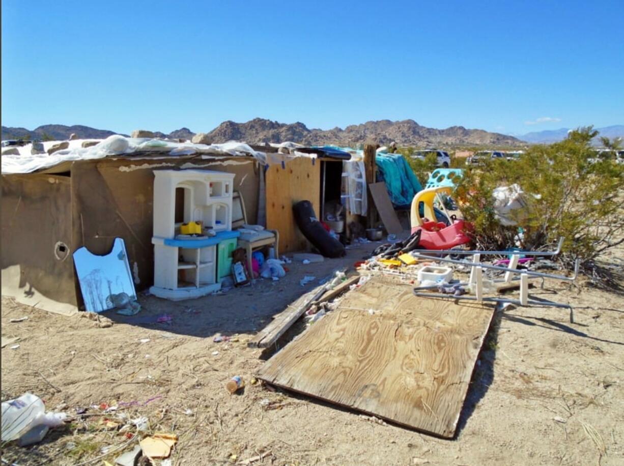 Authorities say a couple, their three children and dozens of cats were living in this structure in Joshua Tree, Calif.