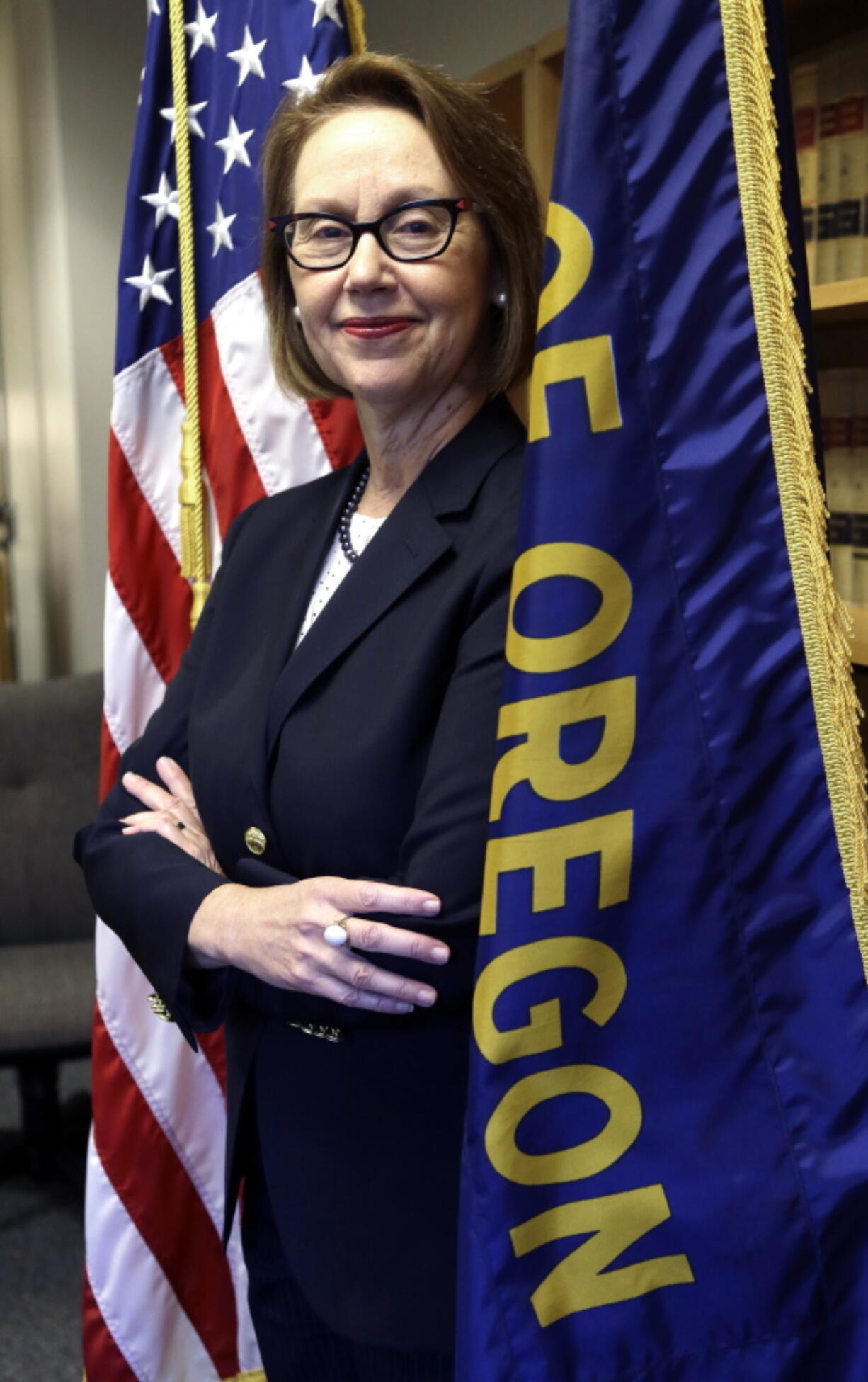 FILE--In this July 13, 2016, Oregon Attorney General Ellen Rosenblum poses for a photo at her office in Portland, Ore. Rosenblum says Facebook might have violated a new state law that protects online customers’ private information and also disclosed in an interview with AP that she and several other state attorneys general are drafting a letter to Facebook, asking how it allowed a developer to weaponize the data of millions of customers, and says a full-scale investigation might ensue.