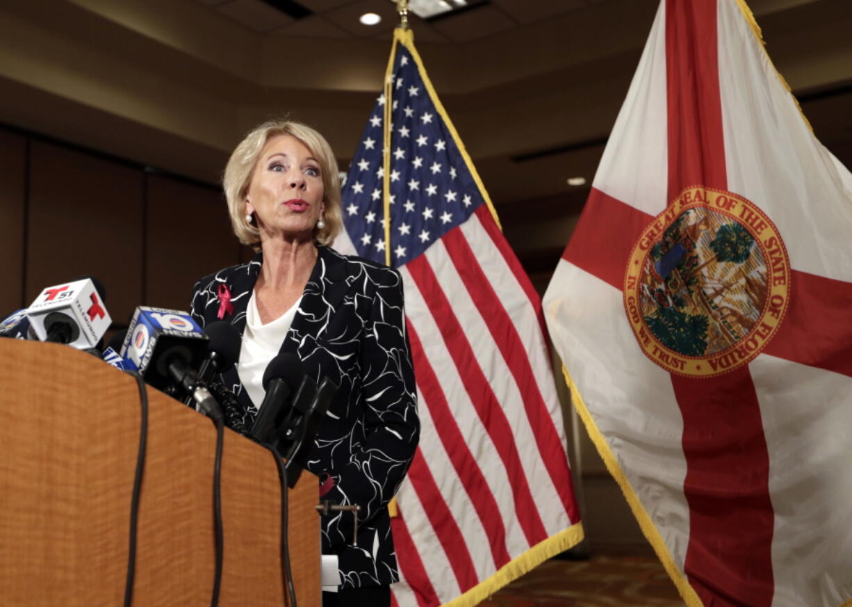 Secretary of Education Betsy DeVos speaks at a news conference following a visit to Marjory Stoneman Douglas High School in the aftermath of the Feb. 14 mass shooting at the school, Wednesday, March 7, 2018, in Coral Springs, Fla.