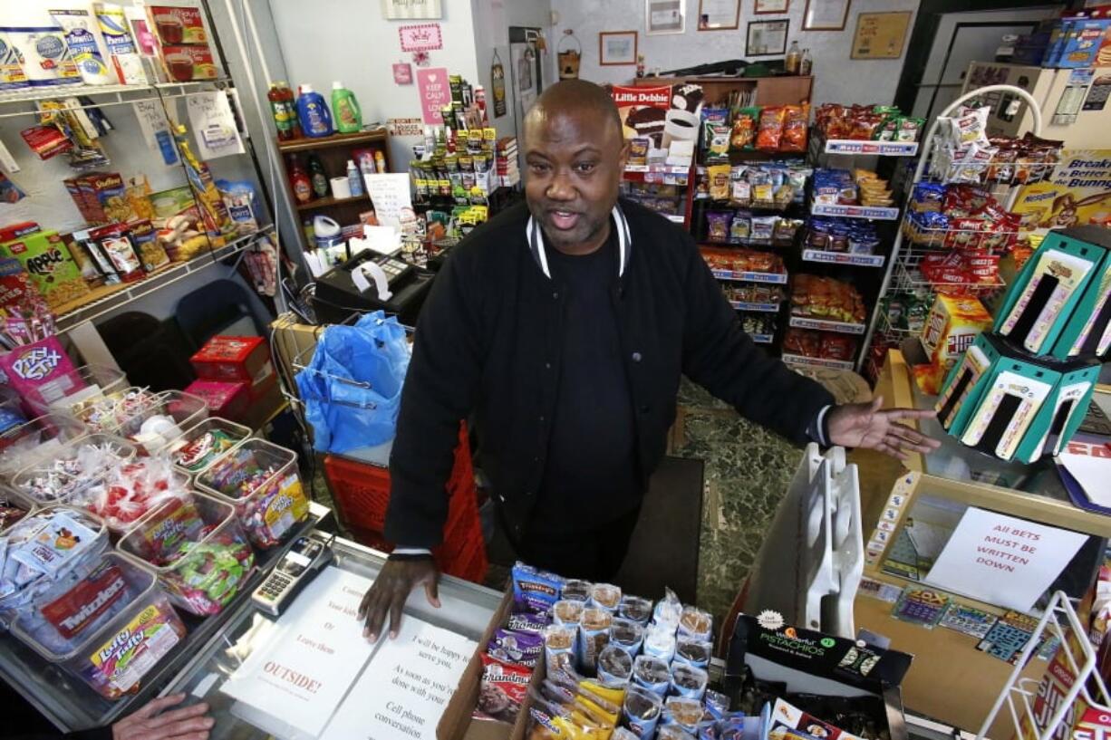 Carl Lewis talks in his market in Rankin, Pa. About half of Lewis’ customers pay with benefits from the federal Supplemental Nutrition Assistance Program, so the government’s proposal to replace the debit card-type program with a pre-assembled box of shelf-stable goods delivered to recipients worries him and other grocery operators in poor areas. “If half your business goes away, it’s going to hurt,” Lewis said. (AP Photo/Gene J.