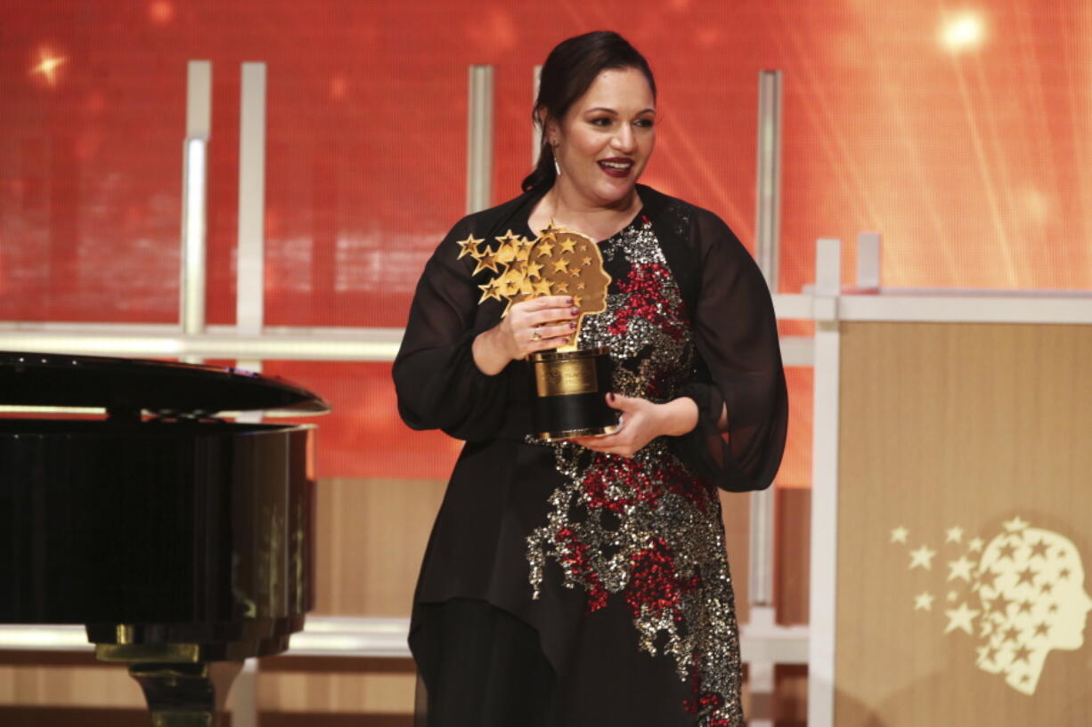 British school teacher Andria Zafirakou reacts Sunday after winning the Global Teacher Prize at a ceremony in Dubai, United Arab Emirates. Zafirakou won the $1 million prize for teaching excellence awarded by the Varkey Foundation.