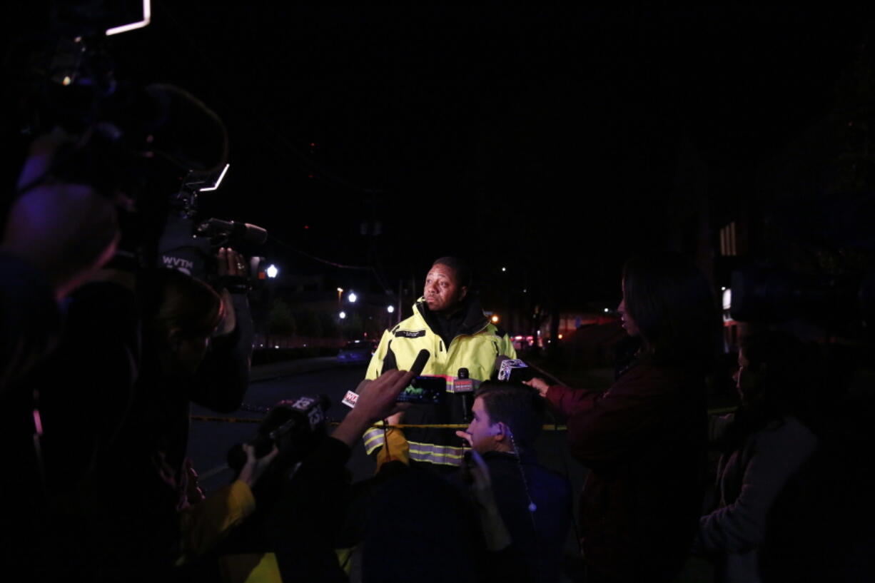 H. R. Watson, the Captain of the Birmingham Fire Department speaks to the media as authorities respond to a gunman that opened fire at a Birmingham, Alabama, hospital, wounding two men before turning the gun on himself Wednesday night, police said on Wednesday in Birmingham, Ala.