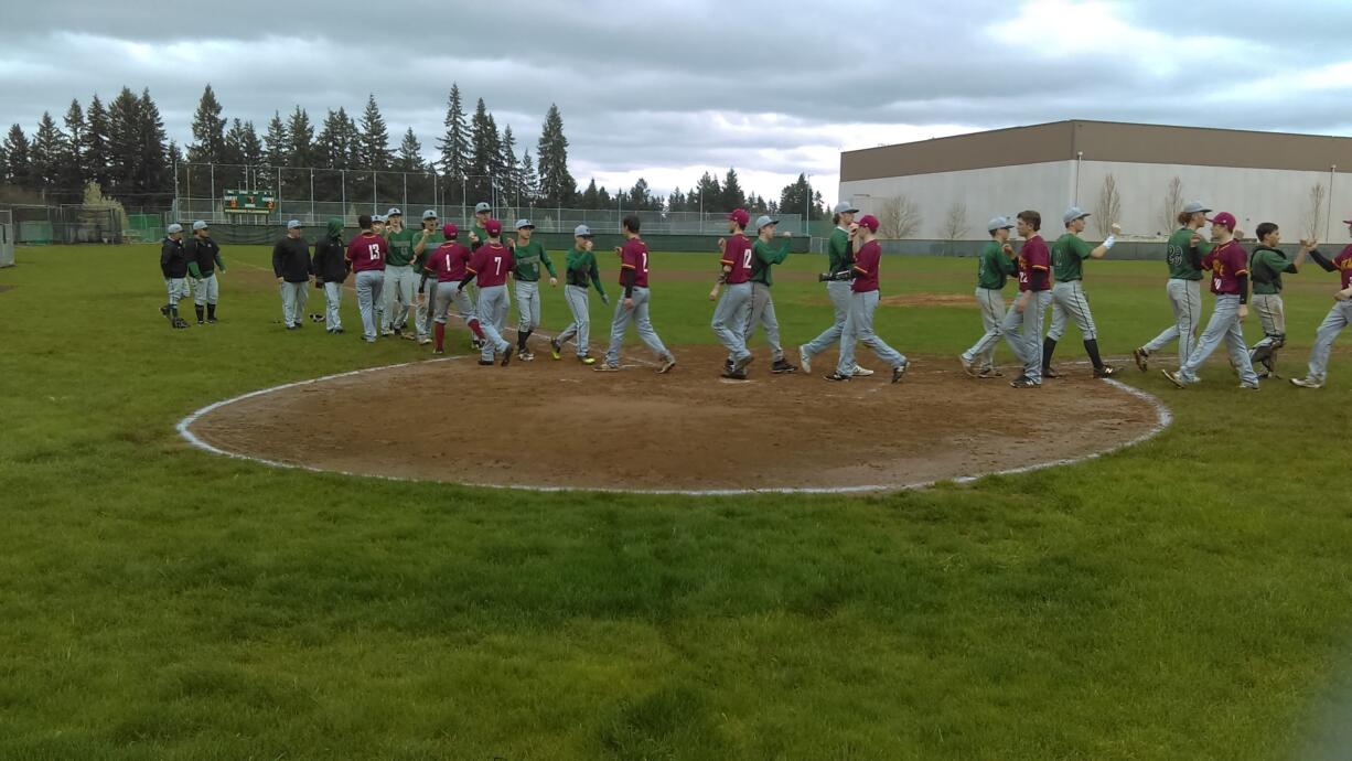 Evergreen players shake hands with Prairie after Evergreen's 2-0 win over the Falcons.