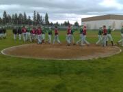 Evergreen players shake hands with Prairie after Evergreen's 2-0 win over the Falcons.