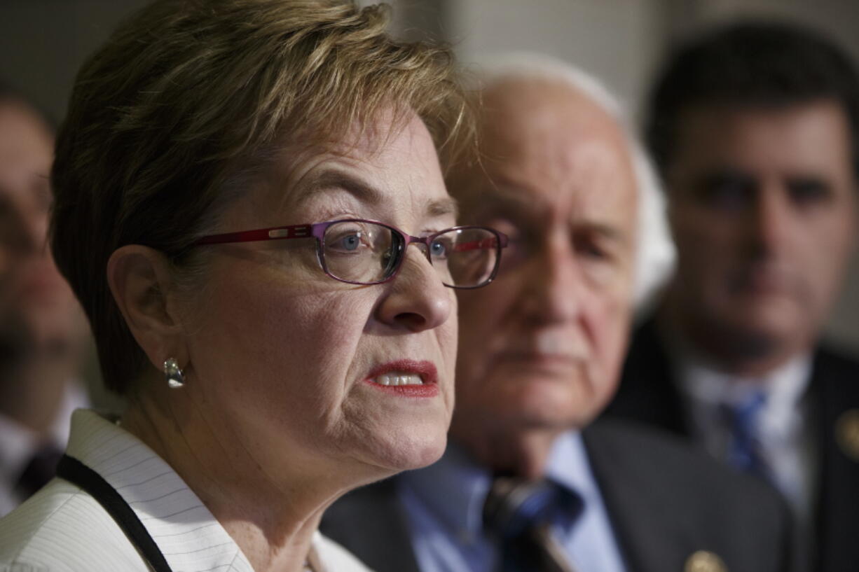 FILE - In this Thursday, Feb. 5, 2015 file photo, members of Congress, Rep. Marcy Kaptur, D-Ohio, and Rep. Sander Levin, D-Mich., join a Ukrainian delegation to voice bipartisan support for bolstering the Ukrainian forces with weapons and aid to stave off incursion from Russia and Ukrainian separatists, during a news conference on Capitol Hill in Washington. Kaptur is now the longest-serving female member ever in the U.S. House. The 71-year-old Democrat from Toledo has served in the House since 1983. (AP Photo/J.