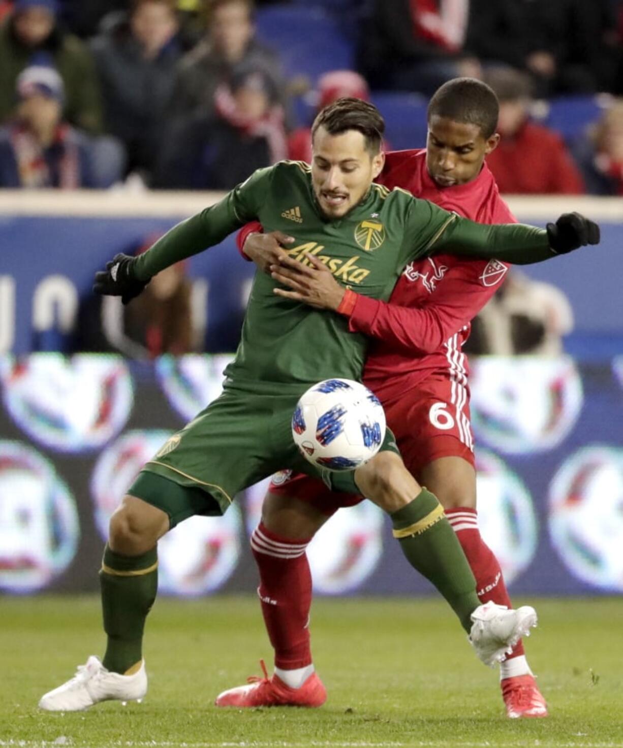 Portland Timbers midfielder Sebastian Blanco, front, and New York Red Bulls defender Kyle Duncan compete for possession of the ball during the first half of an MLS soccer match, Saturday, March 10, 2018, in Harrison, N.J.