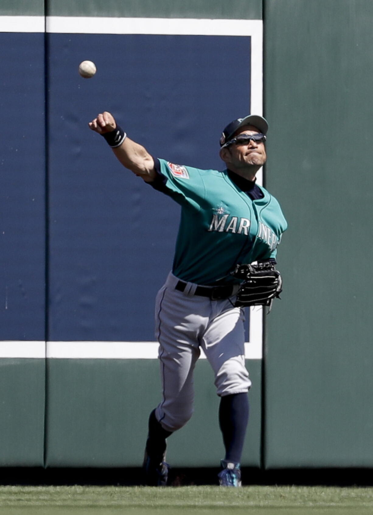 Seattle Mariners right fielder Ichiro Suzuki, of Japan, fields a ball hit by Colorado Rockies’ DJ LeMahieu during the fifth inning of a spring baseball game in Scottsdale, Ariz., Tuesday, March 27, 2018.