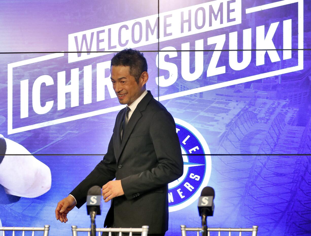 Seattle Mariners' Ichiro Suzuki arrives after signing a contract to a news conference at the teams' spring training baseball complex Wednesday, March 7, 2018, in Peoria, Ariz. Suzuki signed a one year deal in his return to the Mariners.