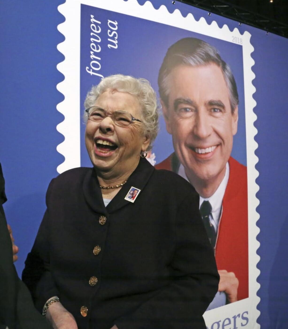 Fred Rogers wife, Joanne Rogers, shares a laugh with friends in front of a giant Mister Rogers Forever Stamp following the first-day-of-issue dedication in WQED’s Fred Rogers Studio in Pittsburgh, Friday, March 23, 2018. (AP Photo/Gene J.