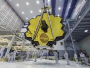 Technicians lift the mirror of the James Webb Space Telescope using a crane at the Goddard Space Flight Center in Greenbelt, Md. The telescope’s 18-segmented gold mirror is specially designed to capture infrared light from the first galaxies that formed in the early universe. On Tuesday, March 27, 2018, NASA announced it has delayed the launch of the next-generation space telescope until 2020.