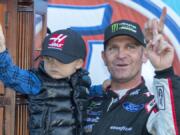 Clint Bowyer, right, celebrates after winning a NASCAR Cup Series auto race at Martinsville Speedway in Martinsville, Va., Monday, March 26, 2018.