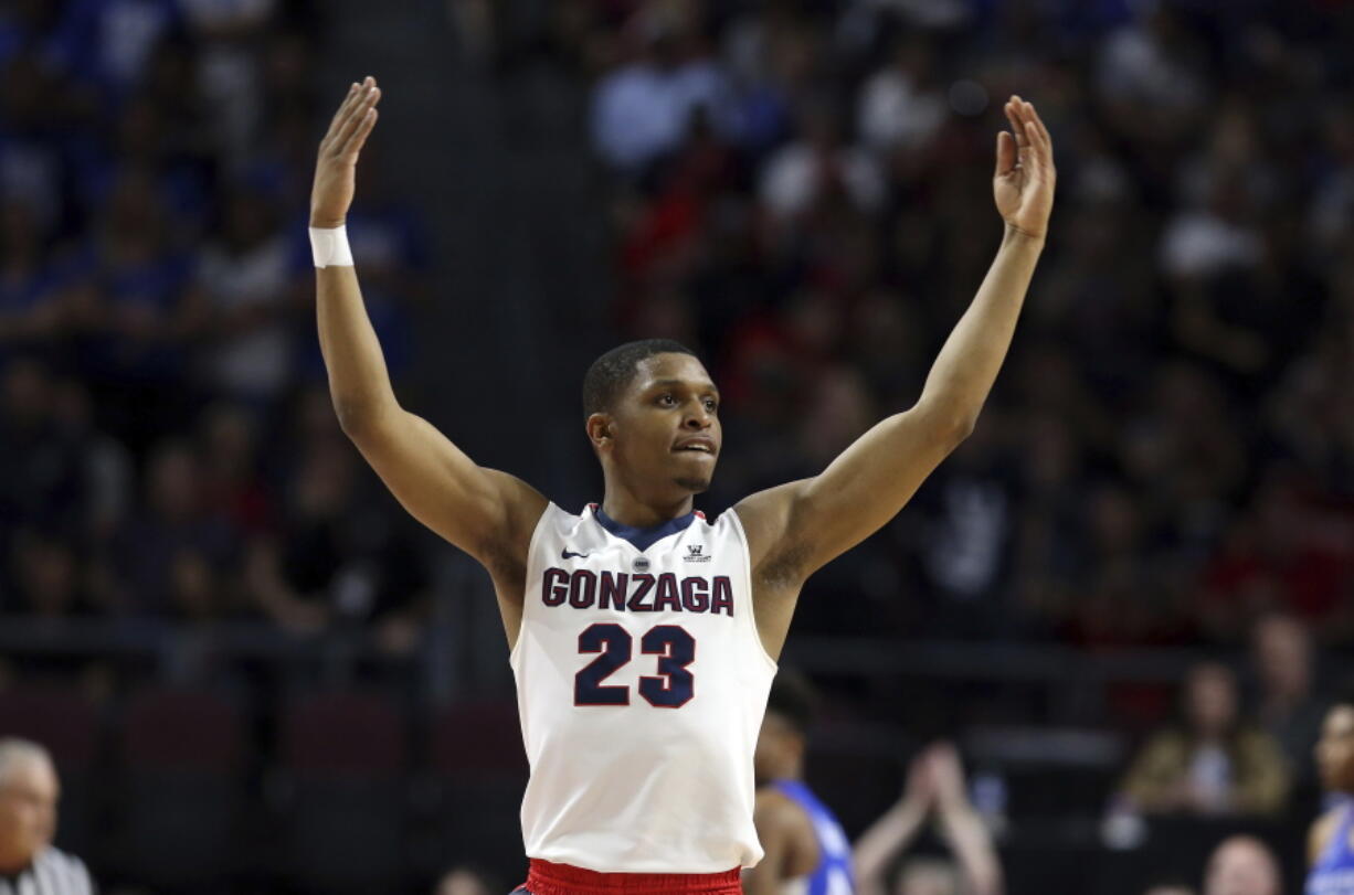 FILE - In this March 6, 2018 file photo Gonzaga’s Zach Norvell Jr. raises his hands to the crowd during the first half of the West Coast Conference tournament championship NCAA college basketball game against BYU in Las Vegas. Norvell is providing Gonzaga with fiery spark on the way to the Sweet 16. Norvell hit tiebreaking 3-pointer in NCAA Tournament opening round and scored 28 points in second round.