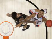 Gonzaga guard Zach Norvell Jr., right, shoots against Florida State forward Phil Cofer during the first half of an NCAA men’s college basketball tournament regional semifinal Thursday, March 22, 2018, in Los Angeles.