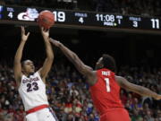 Gonzaga guard Zach Norvell Jr. (23) shoots as Ohio State forward Jae’Sean Tate (1) defends during the first half of a second-round game in the NCAA men’s college basketball tournament Saturday, March 17, 2018, in Boise, Idaho. (AP Photo/Ted S.