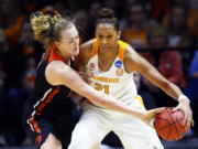 Oregon State center Marie Gulich, left, knocks the ball away Tennessee center Mercedes Russell, right, in the first half of a second-round game in the NCAA college basketball tournament Sunday, March 18, 2018, in Knoxville, Tenn.