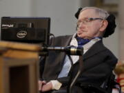 Britain’s Professor Stephen Hawking delivers a keynote speech as he receives the Honorary Freedom of the City of London during a ceremony at the Guildhall in the City of London. Hawking, whose brilliant mind ranged across time and space though his body was paralyzed by disease, has died, a family spokesman said early Wednesday, March 14, 2018.