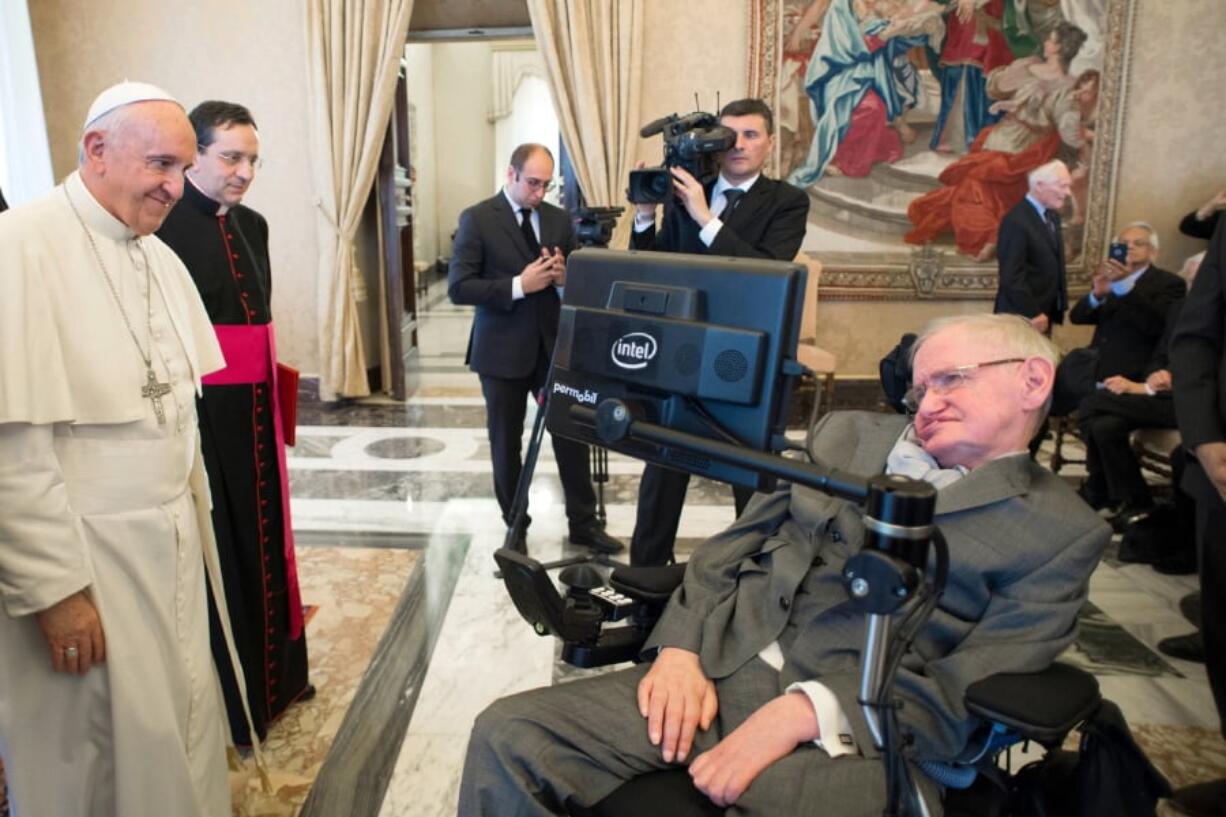 Pope Francis greets physicist Stephen Hawking on Nov. 28, 2016 during an audience with participants at a plenary session of the Pontifical Academy of Sciences, at the Vatican.