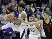 Washington’s Matisse Thybulle, left, leaps to steal the ball on a throw intended for Oregon State’s Tres Tinkle (3) during the second half of an NCAA college basketball game Thursday, March 1, 2018, in Seattle. Washington won 79-77.