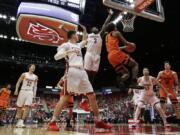 Oregon State guard Ethan Thompson (5) shoots next to Washington State forward Robert Franks (3) during the second half of an NCAA college basketball game in Pullman, Wash., Saturday, March 3, 2018.