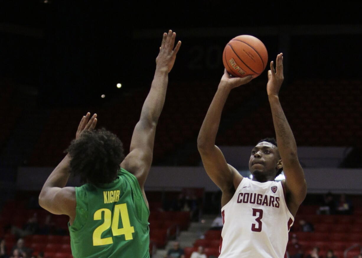 Washington State forward Robert Franks (3) shoots over Oregon forward Abu Kigab (24) during the second half of an NCAA college basketball game in Pullman, Wash., Thursday, March 1, 2018.