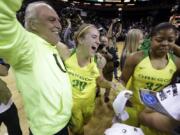 Oregon’s Sabrina Ionescu (20) celebrates with her dad, Dan Ionescu, after the team beat Stanford in an NCAA college basketball game in the finals of the Pac-12 Conference women’s tournament, Sunday, March 4, 2018, in Seattle. Oregon won 77-57.