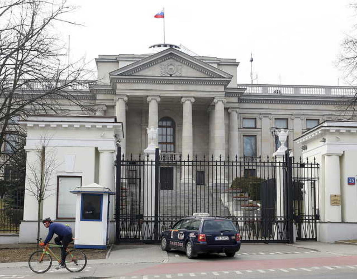 A taxi in front of the Russian Embassy in Warsaw, Poland, Monday, March 26, 2018.Russia's Ambassador to Poland Sergei Andreev was summoned Monday to Poland's Foreign Ministry and said he will stay in Warsaw in the coming weeks, but "we will see" about other embassy employees.(AP Photo/Czarek Sokolowski)