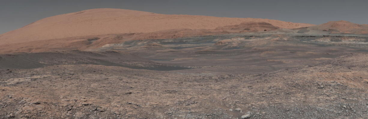 This image provided by NASA, assembled from a series of January 2018 photos made by the Mars Curiosity rover, shows an uphill view of Mount Sharp, which Curiosity has been climbing. Spanning the center of the image is an area with clay-bearing rocks that scientists are eager to explore; it could shed additional light on the role of water in creating Mount Sharp. On Thursday, March 2, 2018, NASA’s Mars rover Curiosity marked 2,000 days on the red planet by Martian standards. A Martian sol, or solar day, is equivalent to 24 hours, 39 minutes and 35 seconds. So 2,000 days on Mars equal 2,055 days here on Earth.