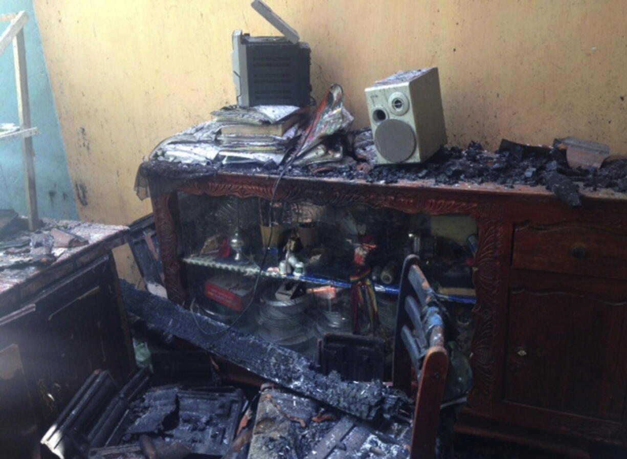 A ransacked and a burnt room of Mohomed Nazar’s house is seen in Pallekele, Sri Lanka, on Thursday. Residents say Buddhist mobs have swept through Muslim neighborhoods in Sri Lanka’s central hills, destroying stores and restaurants despite a curfew, a state of emergency and a heavy deployment of security forces.