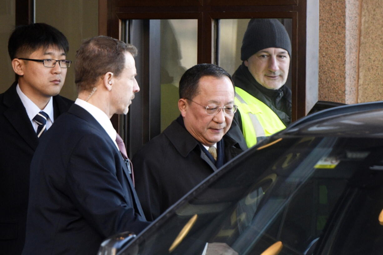 North Korean Foreign Minister Ri Yong Ho, second right, leaves the Swedish government building Rosenbad in central Stockholm, Sweden, Friday, March 16, 2018.