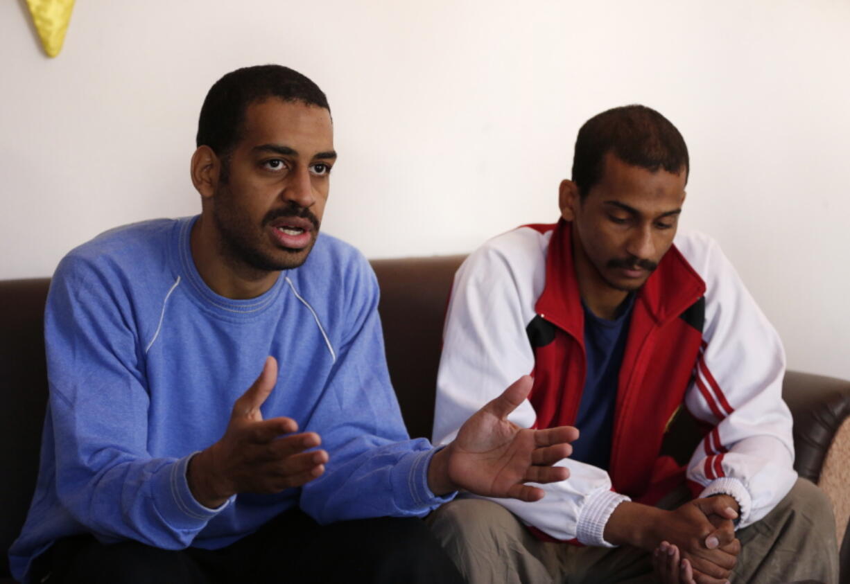 Alexanda Amon Kotey, left, and El Shafee Elsheikh, who were allegedly among four British jihadis who made up a brutal Islamic State cell dubbed “The Beatles,” speak during an interview with The Associated Press at a security center in Kobani, Syria, on Friday. The men said that their home country’s revoking of their citizenship denies them fair trial. “The Beatles” terror cell is believed to have captured, tortured and killed hostages including American, British and Japanese journalists and aid workers.