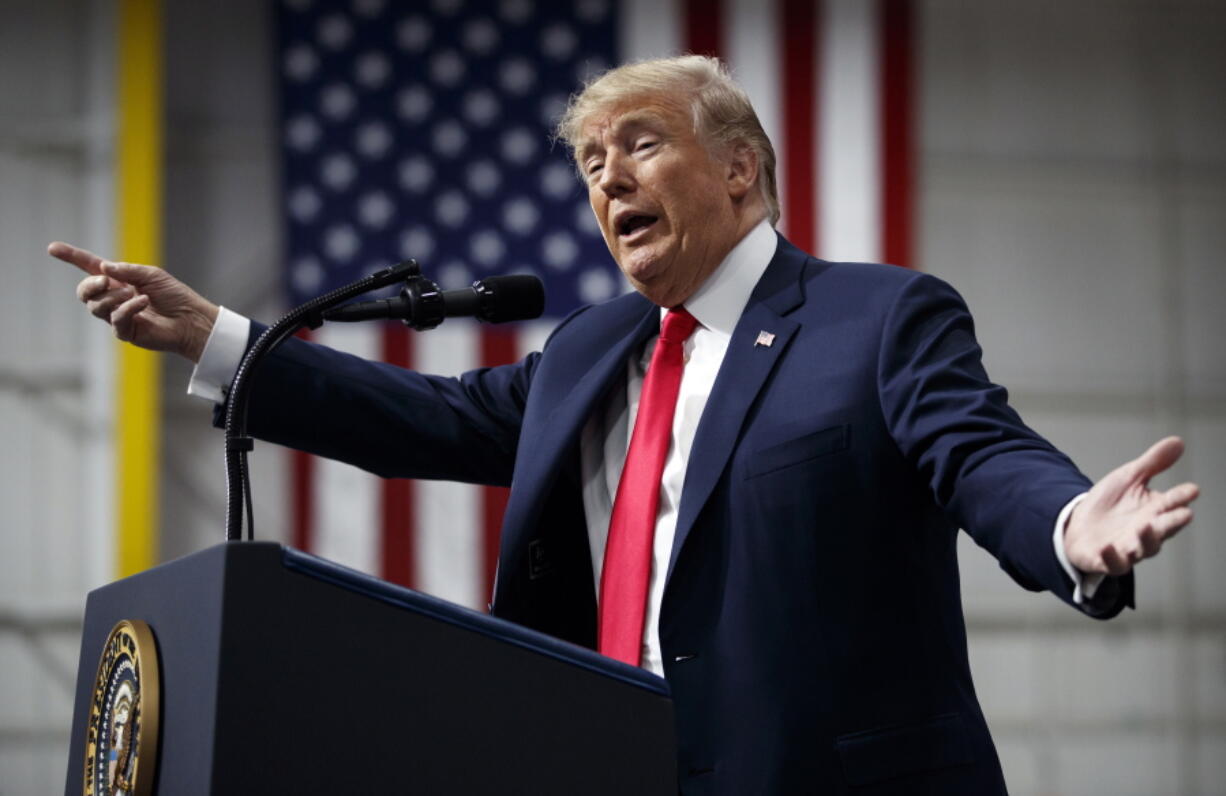 President Donald Trump speaks at a campaign rally Saturday at Atlantic Aviation in Moon Township, Pa. Weeks after prodding lawmakers to stand up to the National Rifle Association, Trump is backing off his call for increasing the minimum age to buy an assault weapon — an idea strongly opposed by the NRA.