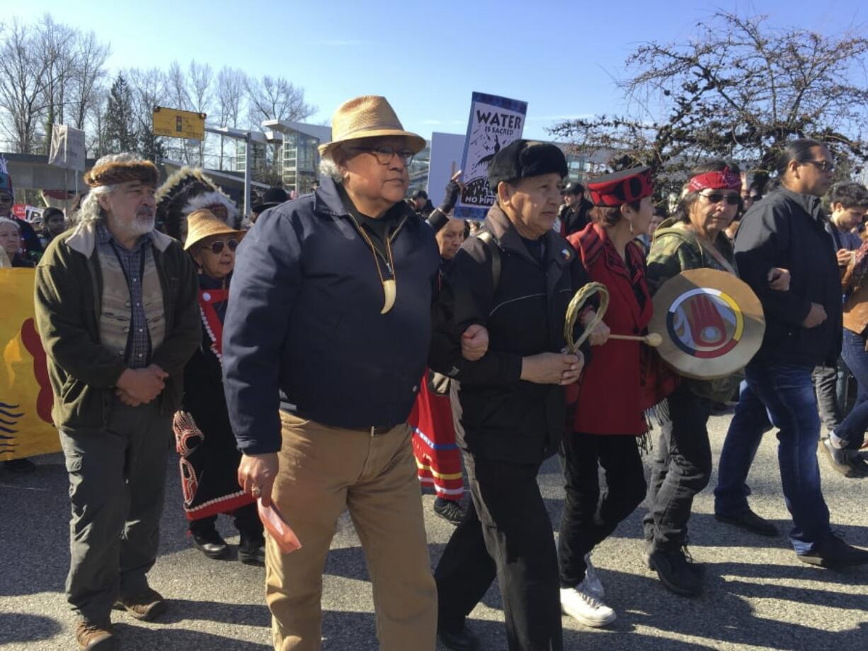 Protesters rally against a pipeline expansion in Burnaby, British Columbia, Canada, Saturday, March 10, 2018. The protesters are calling on people to raise their voices Saturday to stop a $5.7 billion pipeline ($7.4 billion Canadian) expansion project that pumps oil from Canada’s tar sands to the Pacific Coast.