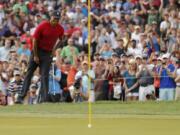 Tiger Woods reacts as his chip comes up just short on the 15th hole during the final round of the Valspar Championship golf tournament Sunday, March 11, 2018, in Palm Harbor, Fla.