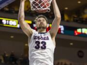 Gonzaga’s Killian Tillie (33) dunks against Loyola Marymount during the second half of an NCAA college basketball game in the quarterfinals of the West Coast Conference tournament, Saturday, March 3, 2018, in Las Vegas. (AP Photo/L.E.