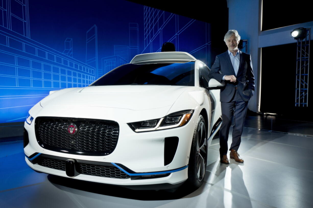 John Krafcik, CEO of Waymo, stands with the Jaguar I-Pace vehicle Tuesday in New York.