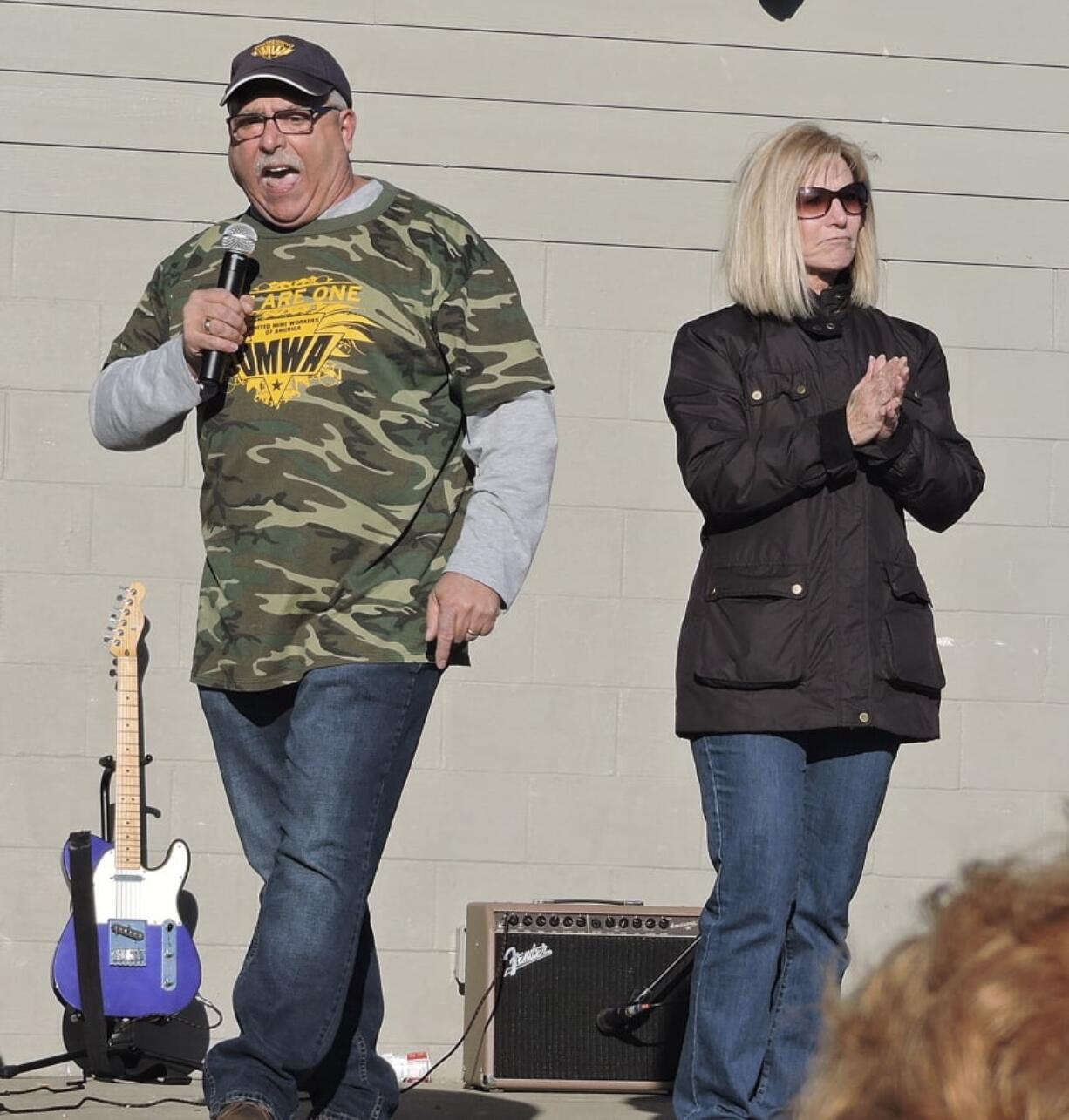 Mike Caputo and Linda Longstreth, representatives for the House of Delegates for District 50, speak of the school employees’ effect on Charleston at the teachers rally in Palatine Park in Fairmont, W.Va., on Sunday.